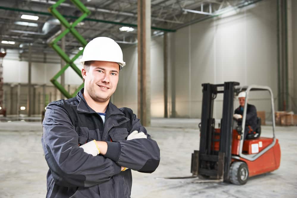 workers compensation insurance - employee in front of a fork lift