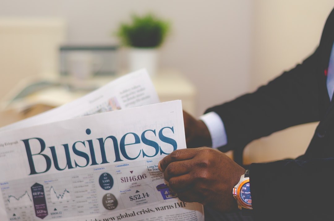 Business Insurance - Businessman reading nespaper